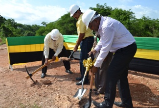 Minister without Portfolio in the Ministry of Transport, Works and Housing, Hon. Dr. Morais Guy (right); along with Minister of Tourism and Entertainment and Member of Parliament, Western Westmoreland, Hon. Dr. Wykeham McNeill (centre) and Mayor of Savanna-La-Mar, Councillor Bertel Moore (left); break ground for the Whitehall Phase 3 Housing Development in Negril on July 18. The project will result in some 590 housing solutions at a cost of $390 million.
