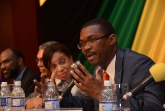 State Minister in the Ministry of Foreign Affairs and Foreign Trade, Hon. Arnaldo Brown (right), fields questions during an interactive session held on Monday, June 17, as part of the 5th Biennial Jamaica Diaspora Conference, now underway at the Montego Bay Convention Centre. Listening are State Minister in the Ministry of Industry, Investment and Commerce, Hon. Sharon Fflokes Abrahams (2nd right); President of SAGICOR Jamaica, Richard Byles (2nd left); and Chairman of the Jamaica Diaspora Foundation, Earl Jarrett.