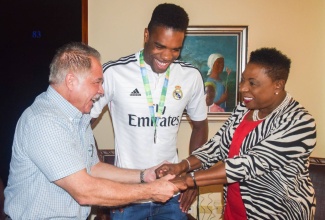 Minister of Culture, Gender, Entertainment and Sport, the Honourable Olivia Grange, shares a light moment with Olympic diver, Yona Knight-Wisdom and Deputy Chef de Mission for the Jamaican Olympic Team. Knight-Wisdom is the first male diver from Jamaica to compete at the Olympic Games.