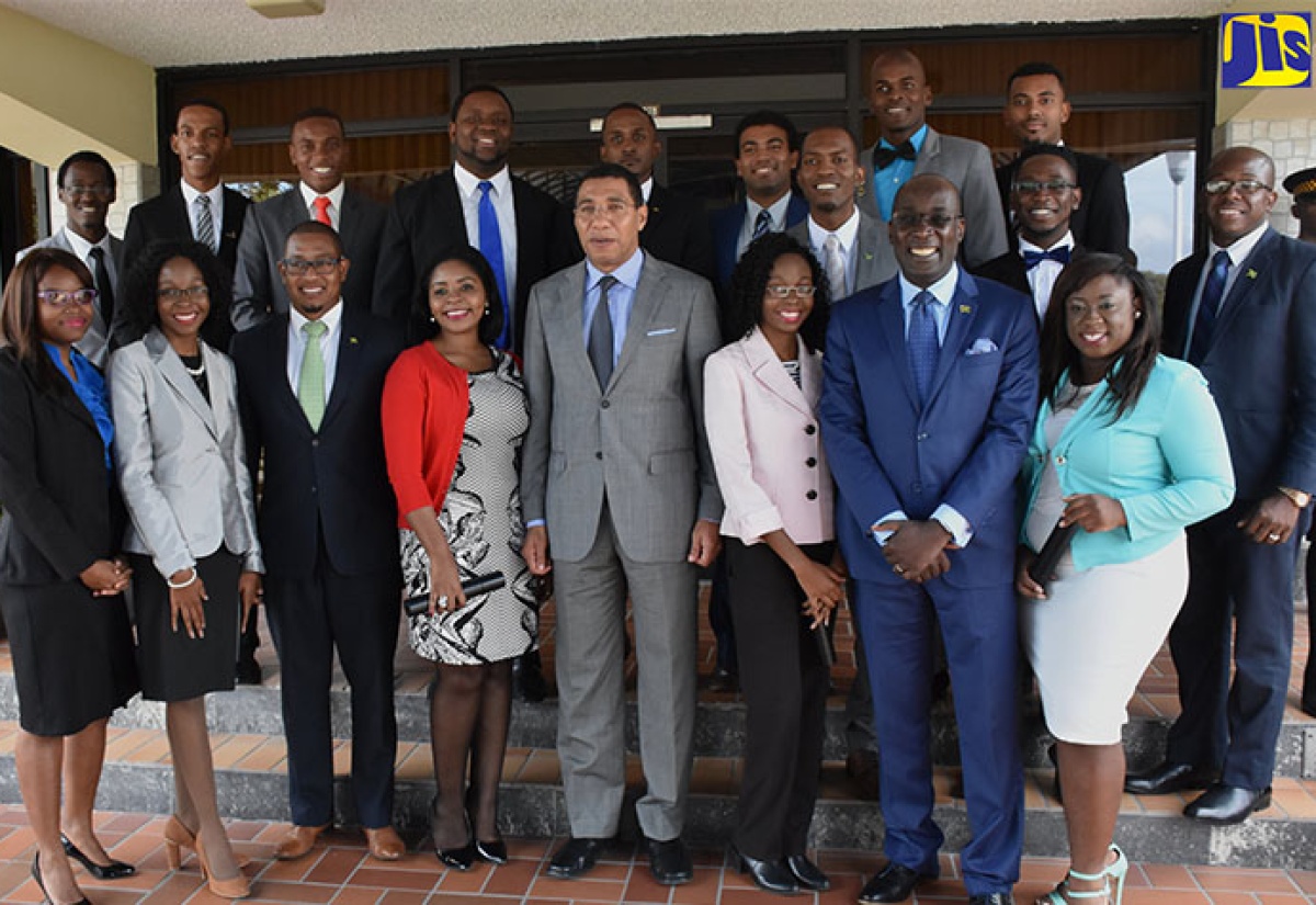Prime Minister, the Most Hon. Andrew Holness (centre); Education, Youth and Information Minister, Senator the Hon. Ruel Reid (second right), and State Minister in the Education, Youth and Information Ministry, Hon. Floyd Green (third left), with the 16 members of the Youth Advisory Council of Jamaica (YACJ), at the  installation ceremony, held at the Office of the Prime Minister, in Kingston, on November 22.  At right (second row), is State Minister in the Ministry of National Security, Senator the Hon. Pearnel Charles Jr.