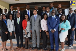 Prime Minister, the Most Hon. Andrew Holness (centre); Education, Youth and Information Minister, Senator the Hon. Ruel Reid (second right), and State Minister in the Education, Youth and Information Ministry, Hon. Floyd Green (third left), with the 16 members of the Youth Advisory Council of Jamaica (YACJ), at the  installation ceremony, held at the Office of the Prime Minister, in Kingston, on November 22.  At right (second row), is State Minister in the Ministry of National Security, Senator the Hon. Pearnel Charles Jr.