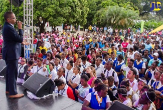 Minister of State in the Ministry of Information, Youth and Information, Hon. Floyd Green, addresses young people gathered on the lawns of Devon House for the inaugural staging of the Elevate Youth Festival, recently.