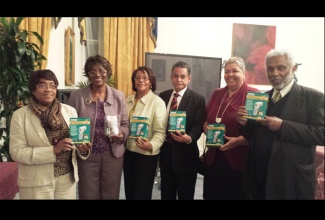 Minister of Local Government  and Community Development, Noel Arscott (3rd right); Jamaican High Commissioner to the United Kingdom, Aloun Ndombet-Assamba (2nd right); and members of the United Kingdom (UK) Diaspora, show off the forehead thermometers valued at nearly $125,000, which have been donated to assist the country’s Ebola preparedness. From left are: Dorothy Turner, Celia Grandison-Markey and Paulette Lewis from the  International Healthcare Group UK; and Laval Bent of the Association of Jamaicans UK Trust. The items were presented to Minister Arscott on Wednesday, November 12, during at a brief ceremony at the Jamaican High Commission in London.




