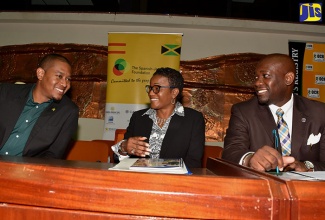 Minister of State in the Ministry of Education, Youth and Information, Hon. Floyd Green (left), in conversation with Deputy Executive Director of National Integrity Action (NIA), Patrece Charles (centre); and Registrar, Office of the Children’s Registry (OCR), Greig Smith. Occasion was the Ananda Alert Missing Children’s Forum at the Jamaica Conference Centre, downtown Kingston, on Thursday (May 25).