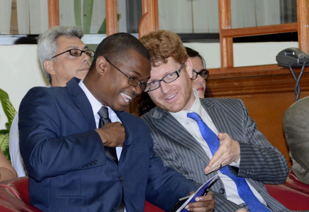 The Hon. Arnaldo Brown, Minister of State in the Ministry of Foreign Affairs & Foreign Trade in discussion with Joshua Polachek, Public Affairs Officer in the United Sates embassy at the reading to mark International Literacy Day at the Ministry of Foreign Affairs & Foreign Trade on Tuesday, September 8.