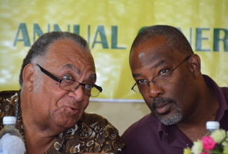 Minister of State in the Ministry of Agriculture, Fisheries, Labour and Social Security, Hon. Luther Buchanan (right), in conversation with Ambassador Derick Heaven, outgoing Chairman of the Sugar Industry Authority (SIA),  during the Westmoreland and Hanover Sugar Cane Growers Association Annual General Meeting, held at Frome on October 22.