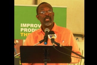 State Minister in the Ministry of Agriculture and  Fisheries,  Hon. Luther Buchanan, addresses Field  Day at the Holland Sugar Estate, In St. Elizabeth,  on October 16. 