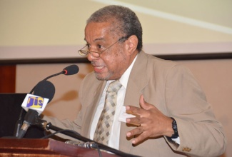 Director General of the Planning Institute of Jamaica (PIOJ), Collin Bullock, addresses participants in the Inaugural Western Jamaica Economic Forum held on Wednesday (November 26), at the Montego Bay Convention Centre in Rose Hall, St. James.   
