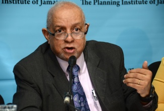 Director General of the Planning Institute of Jamaica (PIOJ), Mr. Colin Bullock, addresses the  PIOJ quarterly economic press briefing, on Thursday, March 3, at the PIOJ headquarters on Oxford Road, in Kingston.