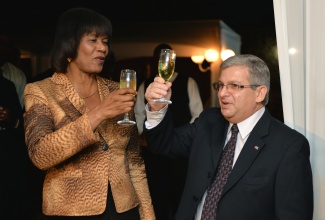 Prime Minister, Hon. Portia Simpson Miller, and Cuba's Ambassador to
Jamaica, His Excellency  Bernardo Guanche Hernandez toast  the 56th
anniversary of the Triumph of the Cuban Revolution (National Day), at a
reception held at the Ambassador's residence in St. Andrew on Thursday (Jan
22), to mark occasion.