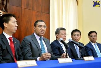 Prime Minister, the Most Hon. Andrew Holness (second left), gives remarks at the signing of a memorandum of understanding for the crafting of technical plans for the development of a centre of Government at National Heroes Park, at Jamaica House on Thursday, March 9. Also pictured (from left) are China’s Ambassador to Jamaica, His Excellency Niu Qingbao; President of China State Construction Engineering Corporation (CSCEC), Xuexuan Zheng; President of China Construction America (CCA), South America, Tiger Wu; and Senior Vice President of CCA, Daniel Liu. Signatories to the MOU are CCA, a subsidiary of CSCEC, the Government of Jamaica and the Urban Development Corporation (UDC).