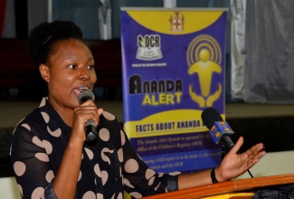 Children’s Officer at the CDA and social worker, Calesha Hylton, addresses a group of parents at a meeting held on March 20 by the Office of the Children’s Registry (OCR), at St. George’s College, North Street, Kingston. 