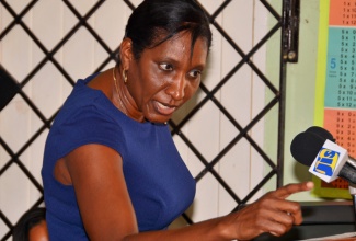 President of the Kiwanis Club of Montego Bay, Delores Clarke, emphasizes a point as she addresses students of Chetwood Memorial Primary School, in Montego Bay, St. James, during the launch of the Club’s Bring Up Grades (BUG) Programme, at the institution, on Wednesday, March 2.