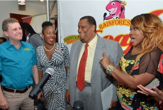 Minister of Agriculture and Fisheries, Hon. Roger Clarke (2nd right), enjoys a light moment with (from left): Chief Executive Officer of Rainforest Seafoods, Brian Jardim; Senior Sponsorship Manager at Digicel, Tahnida Nunes; and Radio personality, Miss Kitty, at the launch of the Rainforest Seafoods Festival on February 11, at Rainforest’s Slipe Road offices in Kingston.  