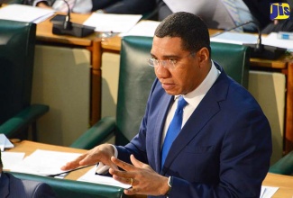 Prime Minister, the Most Hon. Andrew Holness, speaks in the House of Representatives on March 28.