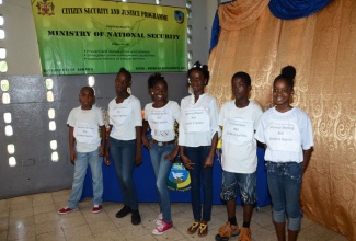 Participants in the grade six category of the Fletcher’s Land Spelling Bee Competition prepare to challenge each year in the contest held on Saturday, October 26, at the Fletcher’s Land Community Centre. The competitors (from left to right) are: Qwayne Williams, Denecia Bryan, Jamailiah Smith, Ayanna Powell, Tai Chambers, and Shanice Sterling, who emerged the winner.