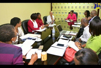 Head of the European Union (EU) Delegation to Jamaica, Malgorzata Wasilewska, addresses production managers at a meeting at the Jamaica Information Service’s (JIS) Half-Way Tree Road headquarters in Kingston on Thursday (March 2). Ms. Waslewska is looking to strengthen partnership with the JIS in communicating the EU’s mandate in working with the Government and other stakeholders on programmes aimed at tackling poverty and achieving sustainable development. At the head of the table is JIS Chief Executive Officer (CEO) Jamaica Information Service (JIS), Donna-Marie Rowe, while Deputy CEO, Ian Boyne is fourth right.