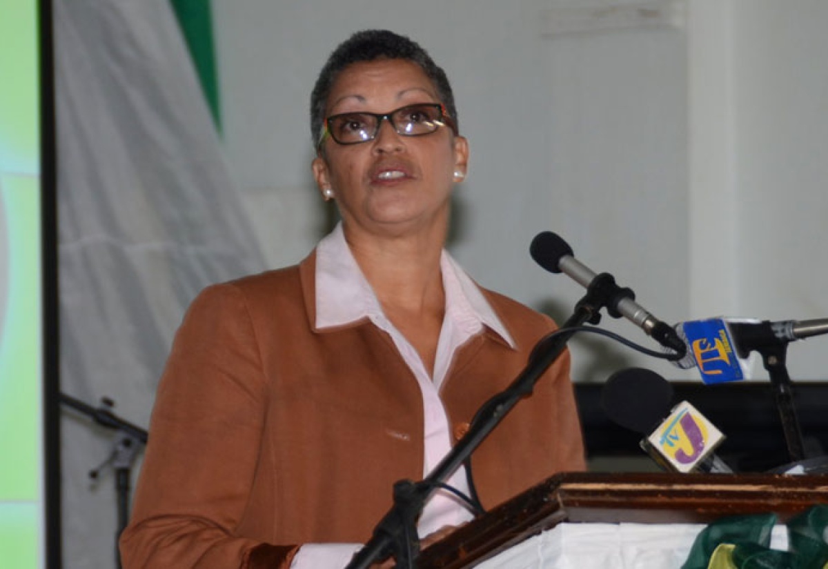 National Education Trust (NET) Director, Kathy Francis-McClure, addressing the recent dedication ceremony for the newly expanded Belair High School, in Mandeville, Manchester.