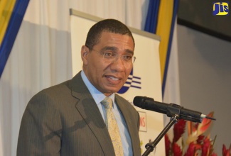 Prime Minister, the Most Hon. Andrew Holness, addresses the Edu/Technical and Vocational Education and Training (TVET) Conference at the Holiday Inn Hotel, Montego Bay, St. James, on December 8.