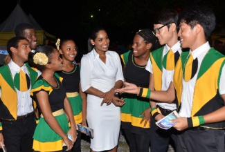 Minister of Youth and Culture, the Honourable Lisa Hanna, MP interacting with performers from International Youth Fellowship (IYF) during the launch of the revitalised Jamaica Festival in June.