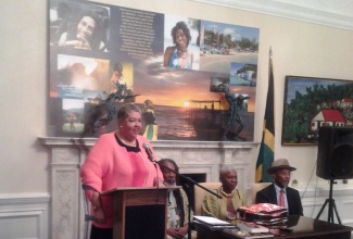 Jamaica’s High Commissioner to the United Kingdom (UK), Her Excellency Aloun Ndombet Assamba, speaks at the London launch of the book ‘Global Reggae’ edited by University of the West Indies (UWI) Professor, Dr. Carolyn Cooper (seated 2nd right).