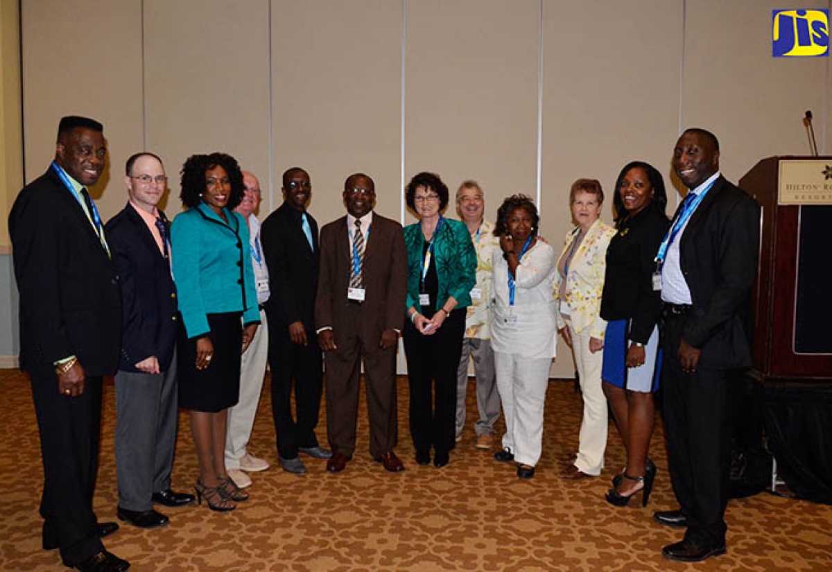 Chair of the Organising Committee of the One Health/One Global Environment Academic Conference and Faculty Forum and lecturer at the University of the West Indies (UWI) Department of Community Health and Psychiatry, Dr. Henroy Scarlett (sixth left), with members of the event’s organising team following the  opening ceremony on Monday, October 23 in Montego Bay.

