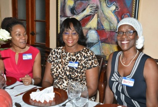 Wife of the Prime Minister, the Most Hon. Juliet Holness (centre), exchanging pleasantries with Founder, International Wome,n Jamaica, Sheryn Hylton Parker (right); and attorney-at-law, Rose Bennett Cooper, during a luncheon hosted by the International Women Jamaica at 1 Skyline Drive, Jacks Hill in St. Andrew, on April 6.