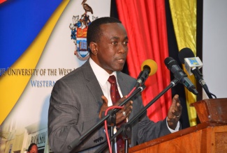 Director of the Caribbean Institute of Media and Communication (CARIMAC), Professor Hopeton Dunn, addressing participants at the graduation ceremony for the first cohort in the 'Animate Jamaica' Certificate Programme, on February 11, at the Western Jamaica Campus of the University of the West Indies (UWI).