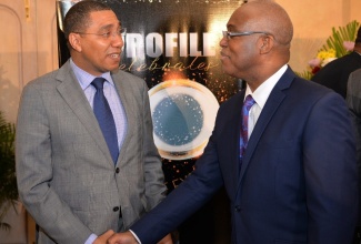 Prime Minister Andrew Holness (left) and Ian Boyne at Profile's 30th Anniversary function earlier this year.  