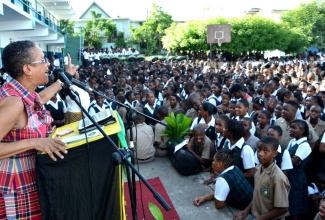 Media Consultant and Lecturer at the Caribbean Institute of Media and Communication (CARIMAC), Fae Ellington, addresses the launch of the Meadowbrook High School Heritage Week activities today (Oct. 14), at the institution in St. Andrew.