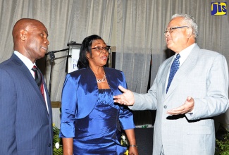 Minister of Justice, Hon. Delroy Chuck (right), is in discussion with Custodes for Kingston and St. Andrew, Hon. Steadman Fuller, and Hon. Dr. Patricia Dunwell, respectively.  Occasion was the commissioning ceremony for 84 Justices of the Peace (JPs) for St. Andrew held on January 15 at The Jamaica Pegasus hotel, New Kingston.