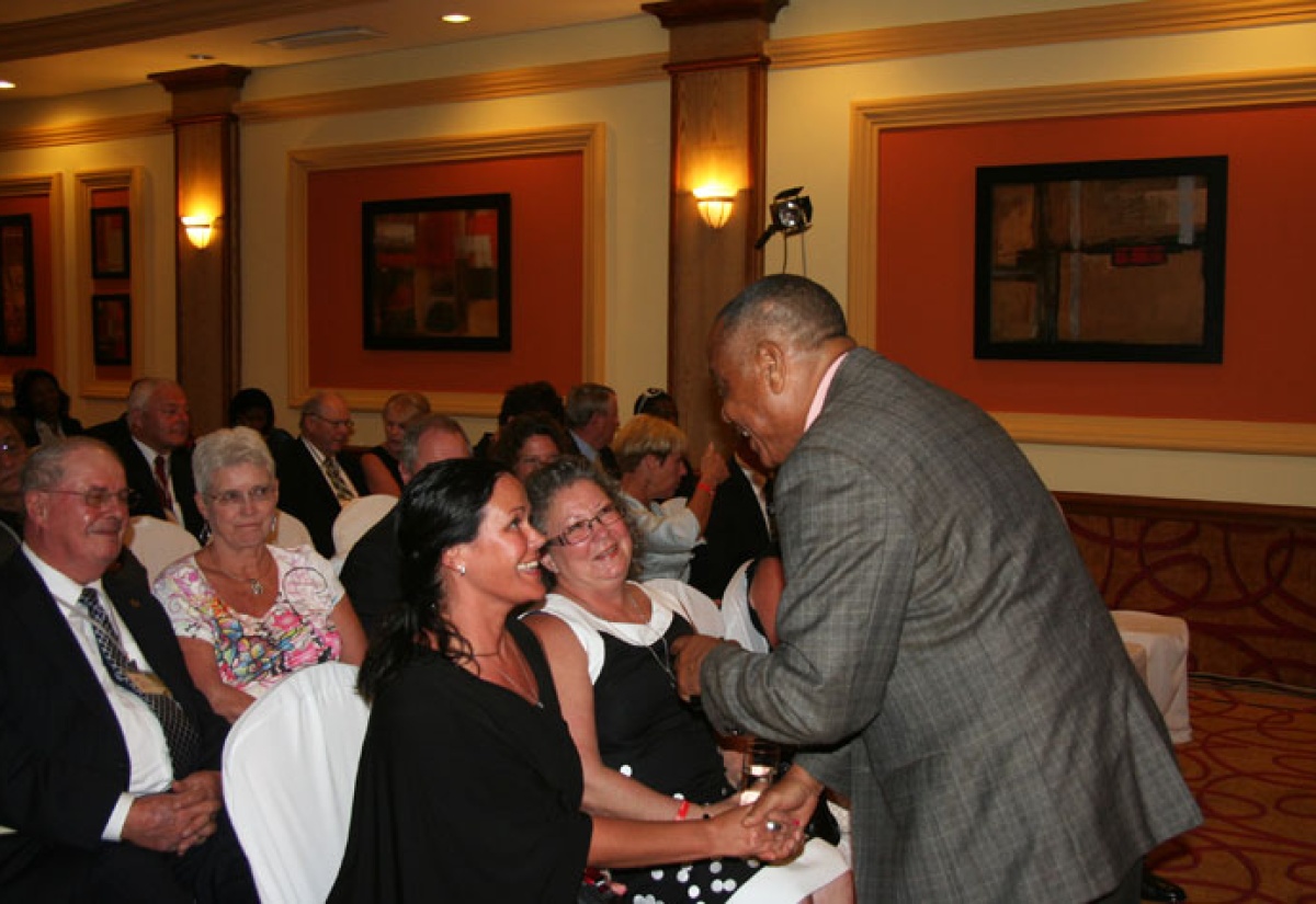 Minister of Labour and Social Security, Hon. Derrick Kellier (right), has a light moment with delegates at the opening of the 2013 Annual Review Meeting for the Canada/Caribbean Seasonal Agricultural Workers Programme, at the Riu Hotel and Resorts in Montego Bay on December 2.