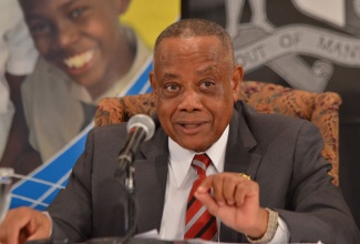      Minister of Labour and Social Security, Hon. Derrick Kellier, addresses journalists at a special Back-to-School press briefing on August 28, at the Office of the Prime Minister in Kingston, where he announced transport benefits for Programme of Advancement Through Health and Education (PATH) students.