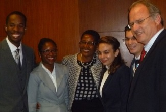 Final year Norman Manley Law School students, Ralston Dickson (left) and Donia Fuller (2nd left), share a moment with Madam Justice Bess Nkabinde (3rd left) of the Constitutional Court of South Africa; United Nations Special Rapporteur on extrajudicial, summary or arbitrary executions, Professor Christof Heyns (right), and  members of the West University of Timisoara team. Occasion was the finals of the 5th World Human Rights Moot Court Competition held on December 10 at the University of Pretoria in South Africa, where Norman Manley took the top prize for the fourth consecutive year.