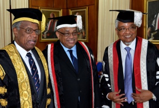 University of the West Indies (UWI) Chancellor, Sir George Alleyne (left), and Vice Chancellor, Professor Nigel Harris (right), share pleasantries with newly inducted Principal of the UWI’s Mona Campus in St. Andrew, Professor Archibald McDonald, following his installation during a ceremony at the institution on Tuesday (October 29). 