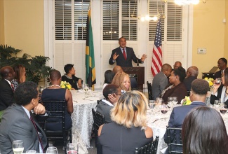 Health Minister, Dr. the Hon. Christopher Tufton (at podium), addresses a group of Jamaican medical practitioners at a dinner at the Embassy of Jamaica in Washington DC recently. To the Minister’s right is Ambassador to the United States, Her Excellency Audrey Marks.  