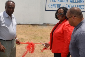 Minister with responsibility for Sports, Hon. Natalie Neita Headley (second right), is greeted by former captain of the Melbourne Cricket Club (MCC), Ruddy Williams (left), during the opening of the Ruddy Williams Centre of Excellence at the MCC headquarters on Courtney Walsh Drive in Kingston, on August 19. Also pictured is: President of the MCC, Mark Neita.