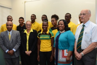 Minister with Responsibility for Sport, Hon. Natalie Neita Headley (second right), is with some of the Jamaican athletes, who have been selected to participate in the 2nd Summer Youth Olympic Games from August 16 to 28 in Nanjing, China.  They were announced during a  press conference held at the headquarters of the Jamaica Olympic Association (JOA) in Kingston on July 17. Pictured second left (front row) is: Chef de Mission, Jacqueline Walter. Also pictured are executives of the JOA (front row, left): Secretary General, Christopher Samuda; President, Hon. Michael Fennell. 