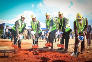 Prime Minister Andrew Holness (centre) breaks ground at Mary's Field Housing Development in St. Catherine (February 28). Accompanying him are (L-R): Mr. Martin Miller, Managing Director, NHT; Ambassador  Dr. Nigel Clarke, Chairman, NHT; Hon. Christopher Tufton, MP West Central St. Catherine; Rev. the Hon. Jeffery McKenzie,  Custos Rotulorum, St. Catherine.  