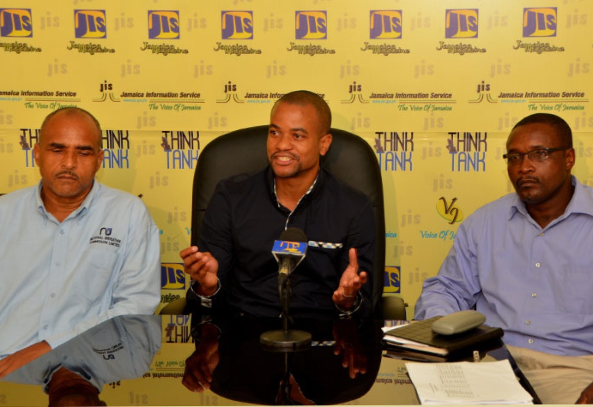 Chief Executive officer of the National Irrigation Commission (NIC), Dr. Mark Richards, addresses a recent JIS Think Tank.  Looking on are Director of Engineering and Technical Services at the NIC, Milton Henry (left); and Design Engineer a the NIC, Renford Smith.