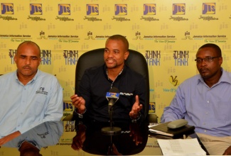 Chief Executive officer of the National Irrigation Commission (NIC), Dr. Mark Richards, addresses a recent JIS Think Tank.  Looking on are Director of Engineering and Technical Services at the NIC, Milton Henry (left); and Design Engineer a the NIC, Renford Smith.