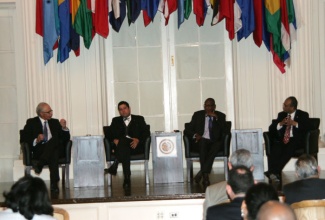 Chairman of the Governor’s Commission on Caribbean Affairs for the State of Maryland, Ambassador Curtis Ward (left), makes a point during a panel discussion held after Wednesday’s (Dec. 11) screening of the documentary ‘Forward Home, the Power of the Caribbean Diaspora’, held on at the Organization of American States (OAS) in Washington DC.  The other panelists (from 2nd left) are: Chairman of the Caucus of CARICOM Ambassadors and Ambassador of Trinidad and Tobago to the United States, His Excellency Dr. Neil Parsan; Lecturer at the University of the West Indies (UWI), Dr. Keith Nurse; and Assistant General Secretary to the OAS, His Excellency Albert Ramdin.  