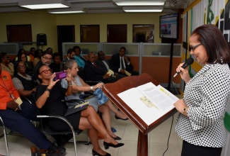 Minister of Labour and Social Security, Hon. Shahine Robinson (left), delivers a presentation to a team at the Ministry during a ceremony hosted for a visit by the Inter-American Development Bank (IDB) on September 6. In the audience (front row, from left), is IDB Country Representative, Therese Turner Jones; and IDB Executive Vice-President, Julie Katzman. The visit was hosted at the Ministry’s North Street office to highlight to IDB the location and operation of the Electronic Labour Exchange (ELE) programme, a component of the Labour Market Information System (LMIS).