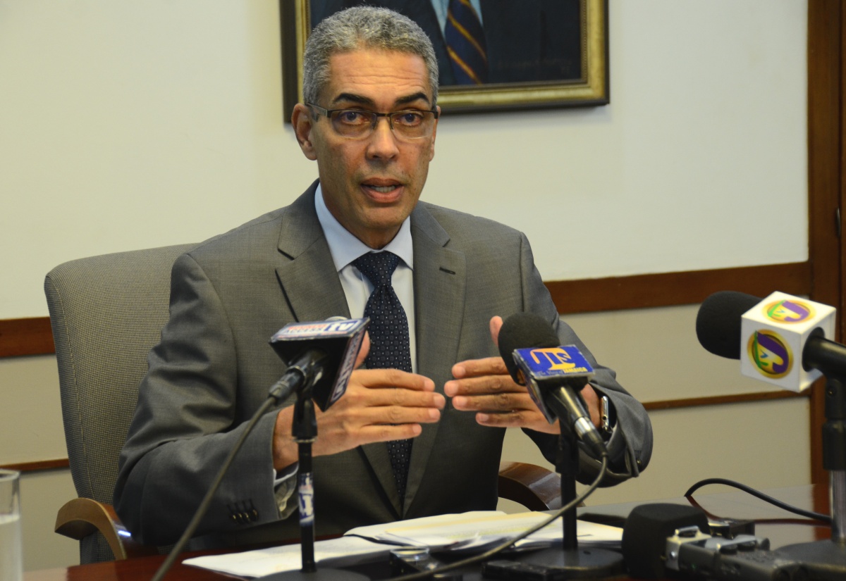 Co-Chairman of the Economic Programme Oversight Committee (EPOC), Richard Byles, addressing journalists at the monthly media briefing at Sagicor Life Jamaica Limited’s head office, in New Kingston, on  February 23.