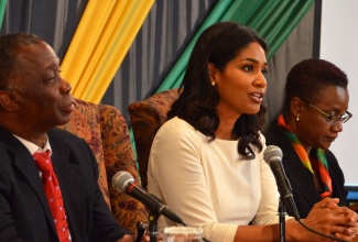 Minister of Youth and Culture, Hon. Lisa Hanna (centre), outlines plans for 2013 Emancipation and Independence celebrations, at the press launch for the activities, at the Office of the Prime Minister, on July 22. At left is Permanent Secretary, Sydney Bartley and Director of Programme Management at the Jamaica Cultural Development Commission (JCDC), Dorett Thaxter, is at right.
