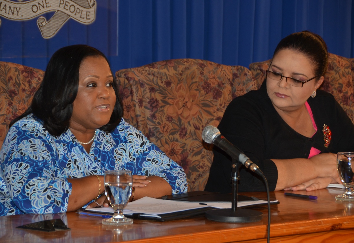 Minister with responsibility for Sport, Hon. Natalie Neita Headley (left), fields questions from journalists during today’s (Sept. 9) Jamaica House press briefing at the Office of the Prime Minister in Kingston. At right is Minister with responsibility for Information, Senator Hon. Sandrea Falconer.