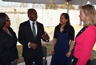 Minister of State in the Ministry of National Security, Senator the Hon. Pearnel Charles Jr. (second left), converses with (from left) Commissioner of Corrections,  Ina Fairweather; Organization of American States representative in Jamaica, Jeanelle van GlaanenWeygel; and Mission Director of the United States Agency for International Development (USAID) in Jamaica, Maura Barry Boyle, during the launch of the programme, dubbed 'A New Path', at the South Camp Juvenile Remand Centre, today (April 7).