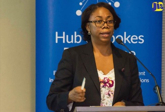 Head of the Trade Agreements Implementation Unit in the Ministry of Foreign Affairs and Foreign Trade, Symone Betton-Nayo, addresses the opening of a two-day National Workshop on Trade in Services at the Courtyard by Marriott Hotel in New Kingston on September 26. 