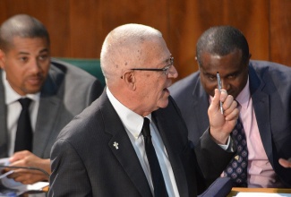 Minister of Education, the Hon. Rev. Ronald Thwaites makes his contribution to the 2013/2014 Sectoral Debate in parliament on Wednesday, May 15.