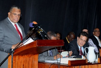 Finance and Planning Minister, Dr. the Hon. Peter Phillips (at podium), addresses the Ministry’s Tax Incentives Reform Package forum on December 4, at the Jamaica Conference Centre, downtown Kingston.